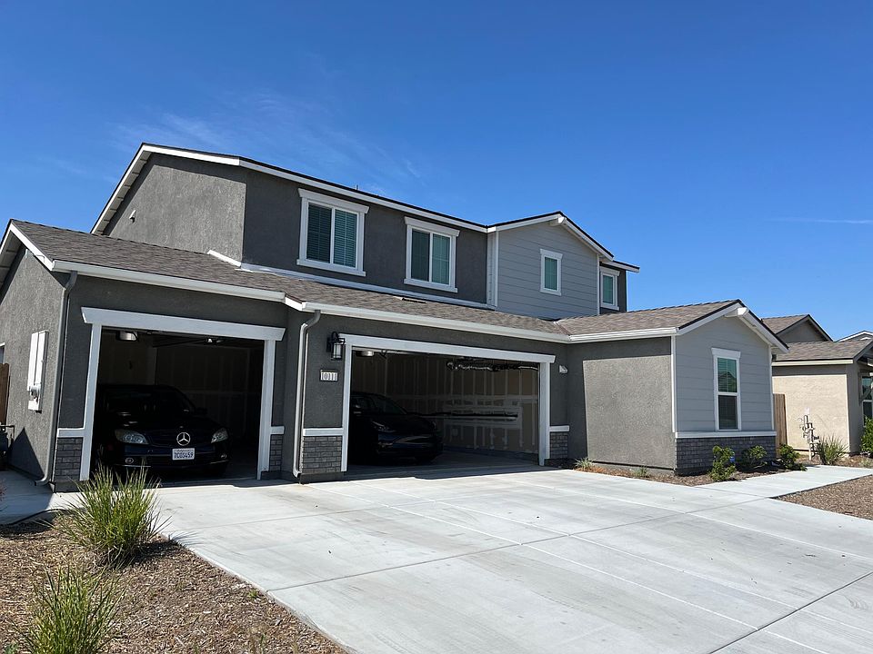 Front view with three car garage