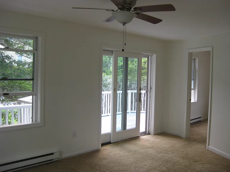 living room with slider to a private deck