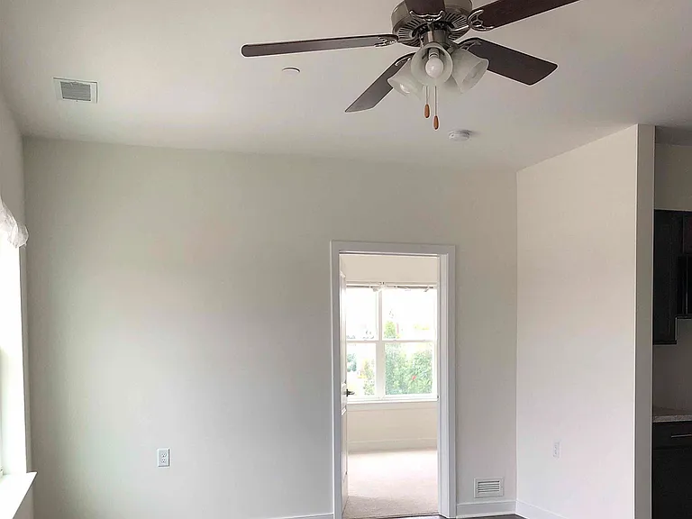 Interior living room with view of bedroom interior