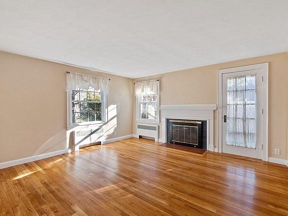 Living Room w/ Wood Burning Fireplace