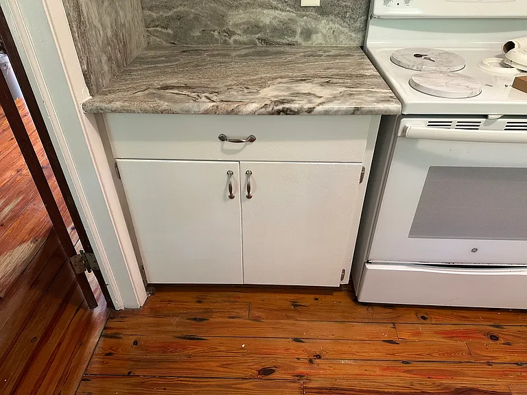 Granite counter over large storage cabinet