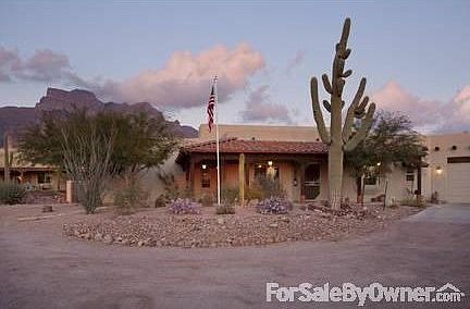 Front Elevation
						:
						Drive leading up to the home.