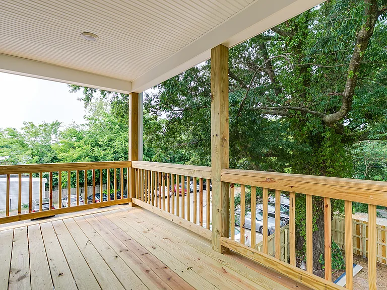 Balcony off primary bedroom, overlooks privacy fenced rear yard