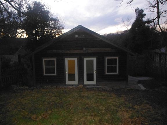 Backyard with bedroom entries to patio