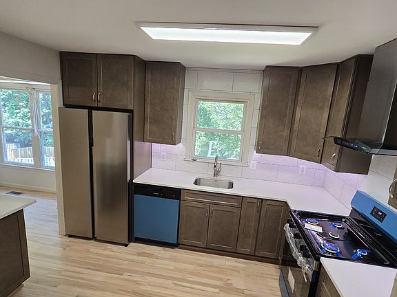100% redesigned kitchen makeover. Cabinets, lights, appliances, countertops.