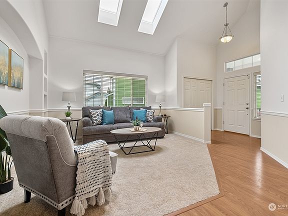 Skylights + Transom windows + vaulted ceilings ensure the Pacific Northwest sunlight lights up inside!>