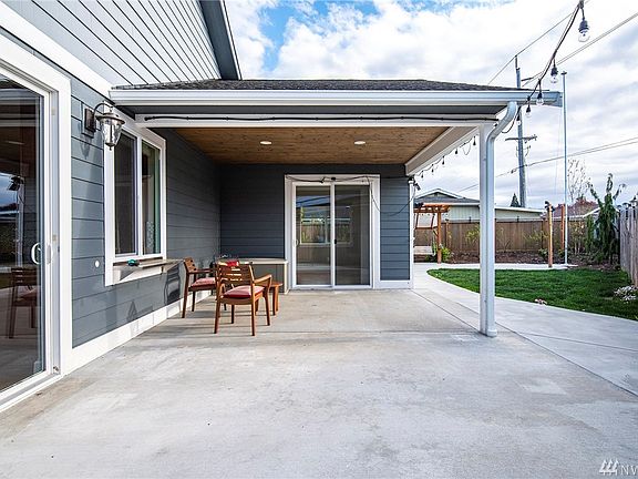 Covered and lighted patio gives you some very special space to be outside and yet protected from breezes and rain.