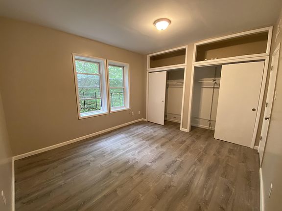 Bedroom with wall to wall closet.