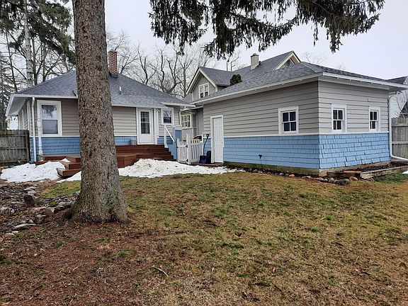 Fully fenced private backyard with deck and brick patio area for grill or fireplace. Garage with opener.