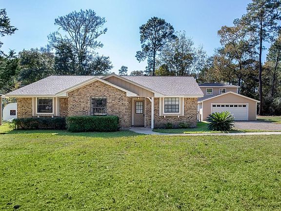 Welcoming entrance! Detached garage with garage apartment.