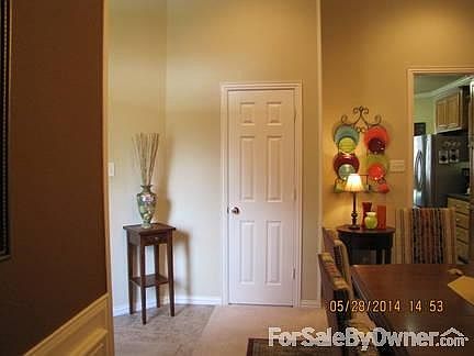 hallway to dining room
						:
						spacious and open, convenient coat closet