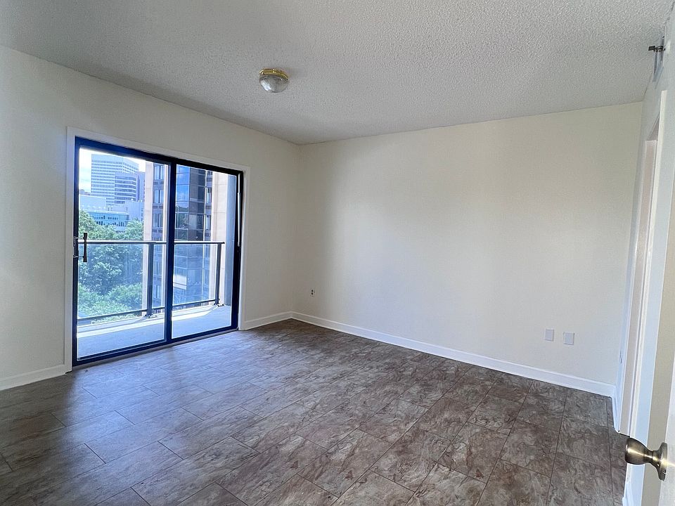 Bedroom with doors leading to balcony