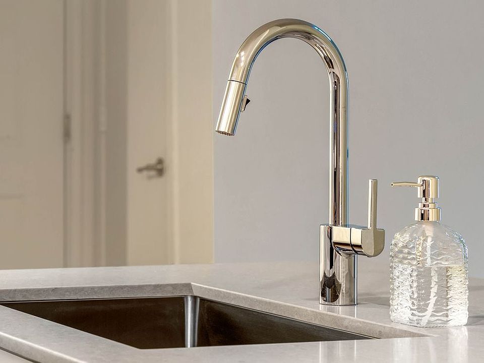 Renovated Package I kitchen with updated plumbing fixtures