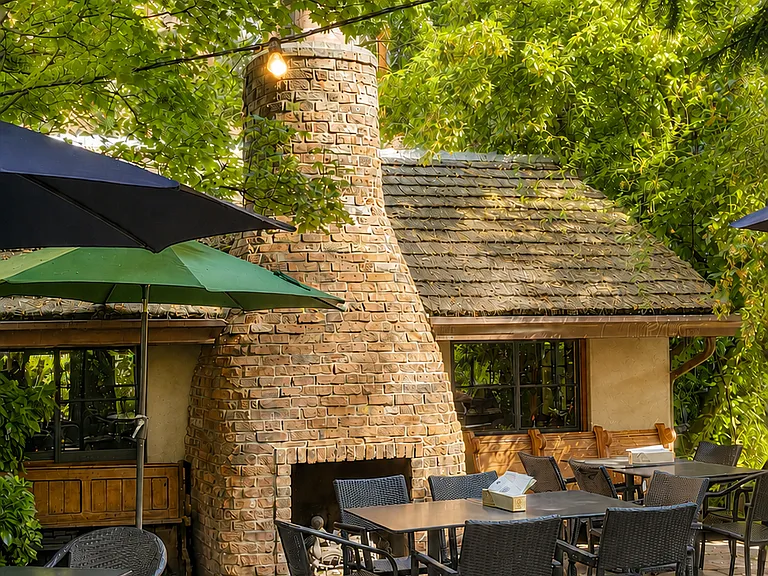 Enjoy the wooded courtyard and fireplace patio at McMenamins.