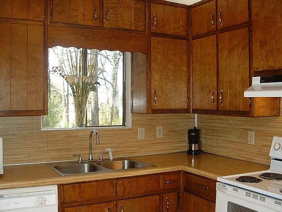 Bright & sunny kitchen with an area for a bistro or cafe' table & chairs.
