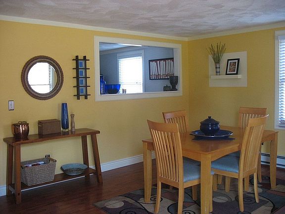 Dining room features a pass thru window to kitchen