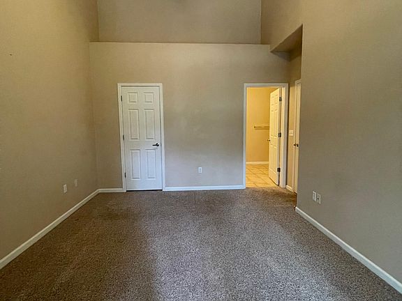 Master bed: large walk in closet, attached private 5 piece bath, vaulted ceilings, ceiling fan, and walkout private balcony