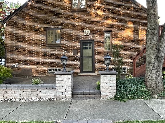 All brick home with professional landscaping and hardscaping