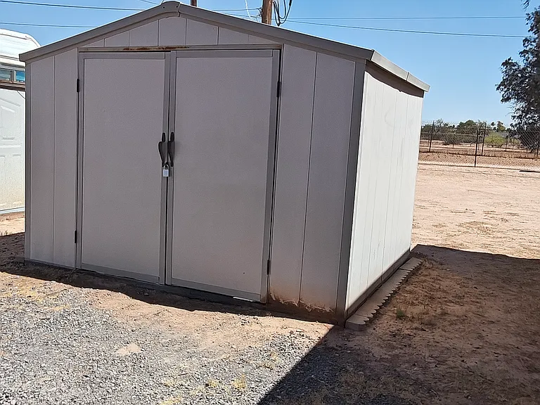 Storage shed included