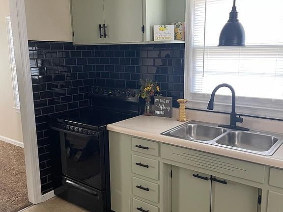 Newly painted cabinets and new door pulls/hinges. Smooth top electric range. New sprayer faucet. New light over sink and kitchen ceiling.