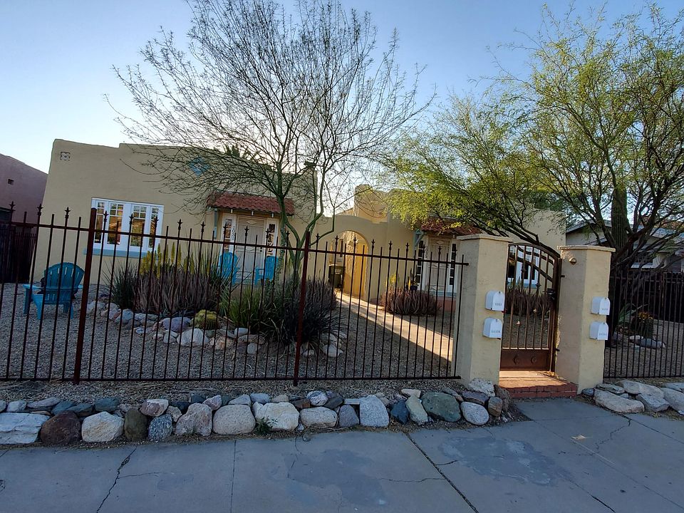 Front of property. Two houses with separate yards and walkway between.