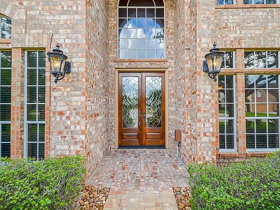 The front door is surrounded by nature creating an attractive entrance for the home.