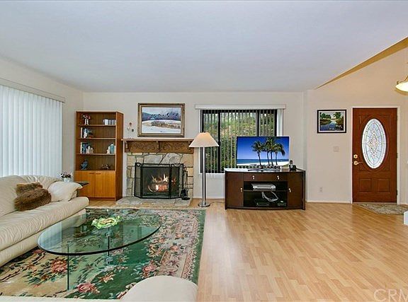 Another view of living room with cozy fireplace