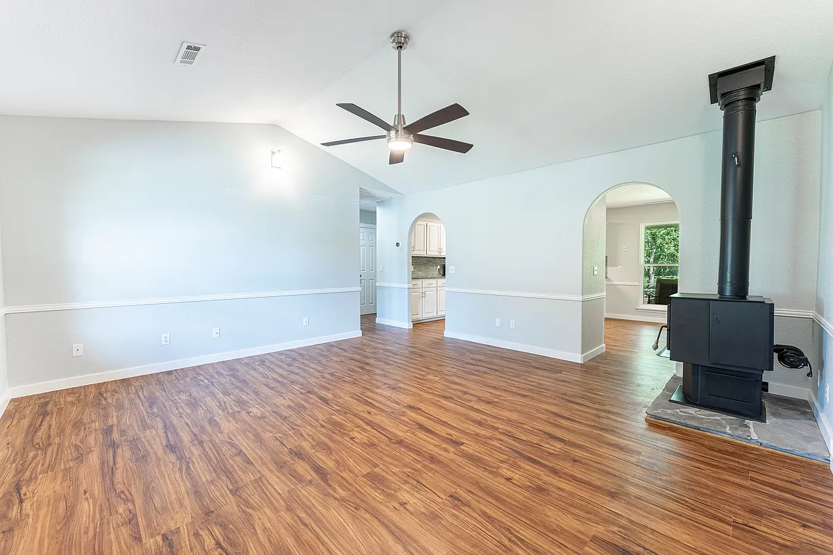 Living room with cathedral ceiling and wood burning stove - 2894 Jessica Pl