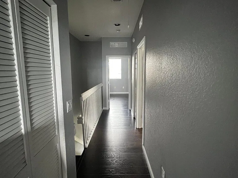 second floor hallway leading to all bedrooms