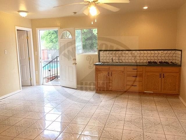 Entrance to open living space with kitchen