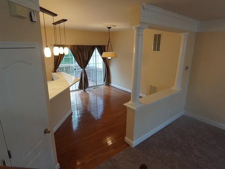 View of eat-in area from stairs to bedroom level