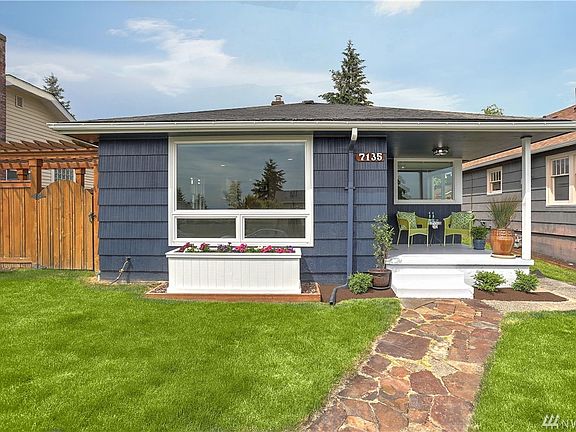 Notice the beautiful side gate and arbor that leads to a stunning garden on the side of the home. Gorgeous laid stone path leads you to your front portico that's the perfect perch. Updated exterior paint and vinyl windows.