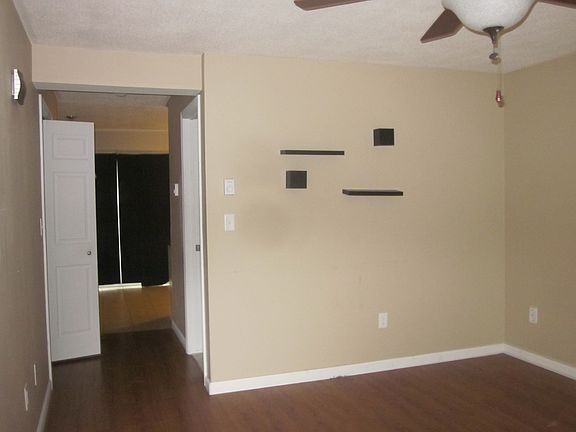 Livingroom into Kitchen w/ Half Bath with Laundry on right