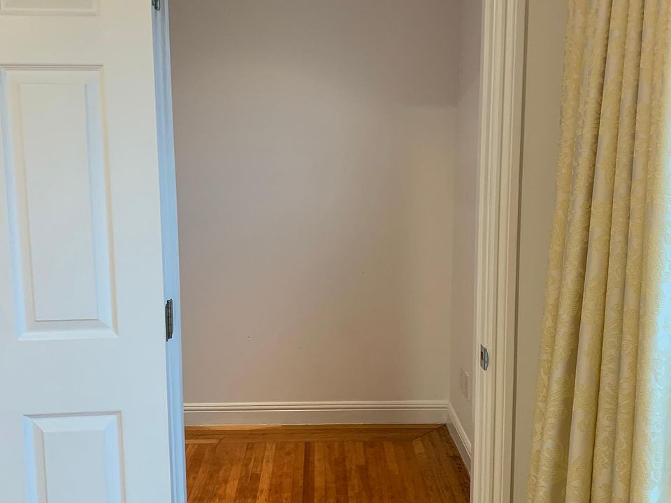 Door to Large Walk-In Closet in Main Bedroom