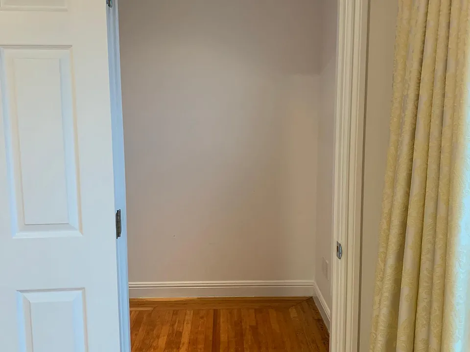 Door to Large Walk-In Closet in Main Bedroom