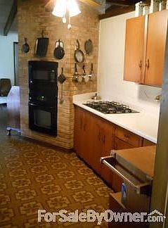Kitchen						:						Open view to back yard!