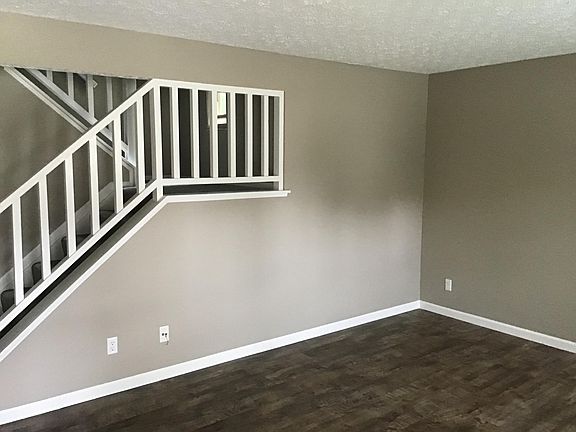 Living Room with Stairs to Second Floor