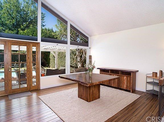 The dining area with french doors to the pool and patio.