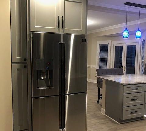 All new appliances. View into dining room with french doors. Counter height eating space.
