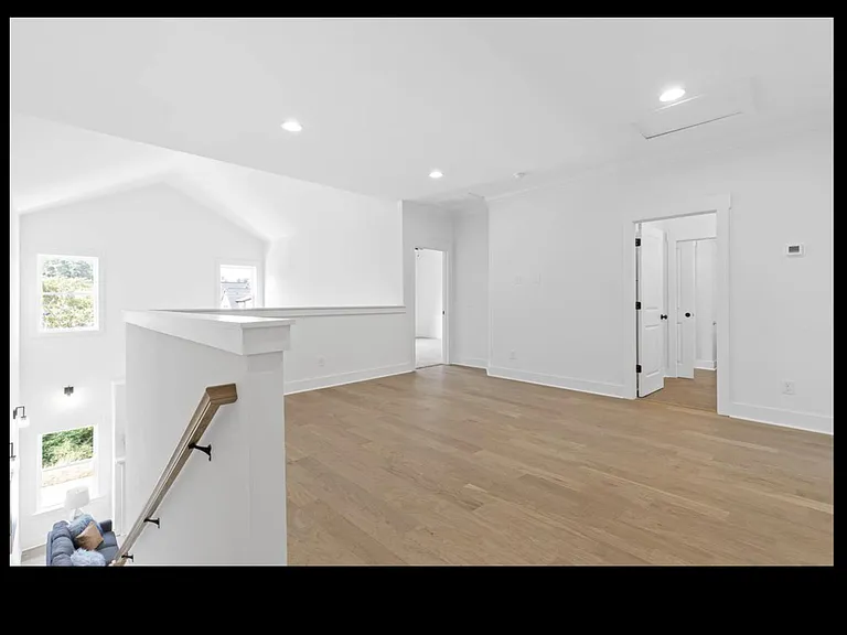 Seating area on upper level, ideal for home theatre.