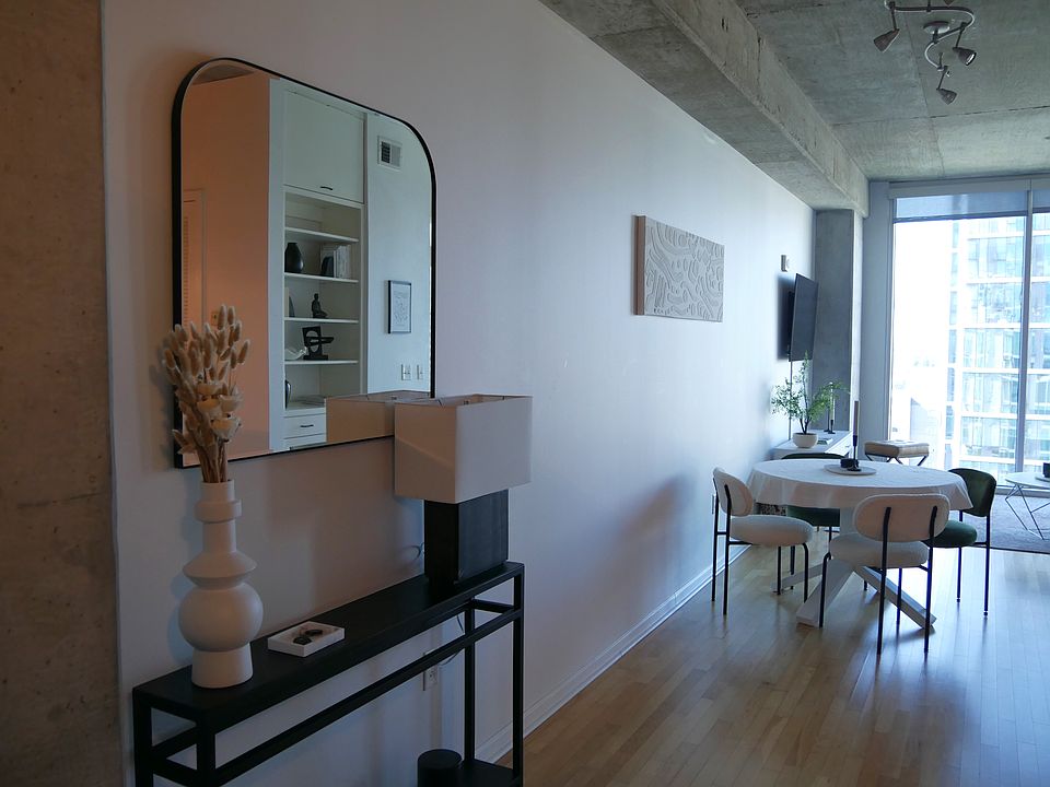 Expandable dining room table with four chairs. Insert will be left for tenant to use.