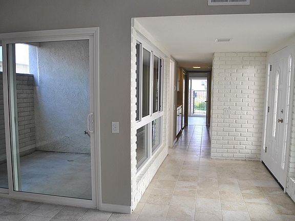 Atrium, front entry and view towards rear.