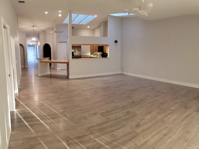 Looking back into the high ceiling, large living space from your west facing Lani. New ceiling fans in every room. Although the fans in the pictures are older, all five fans have been upgraded and are ecofriendly.