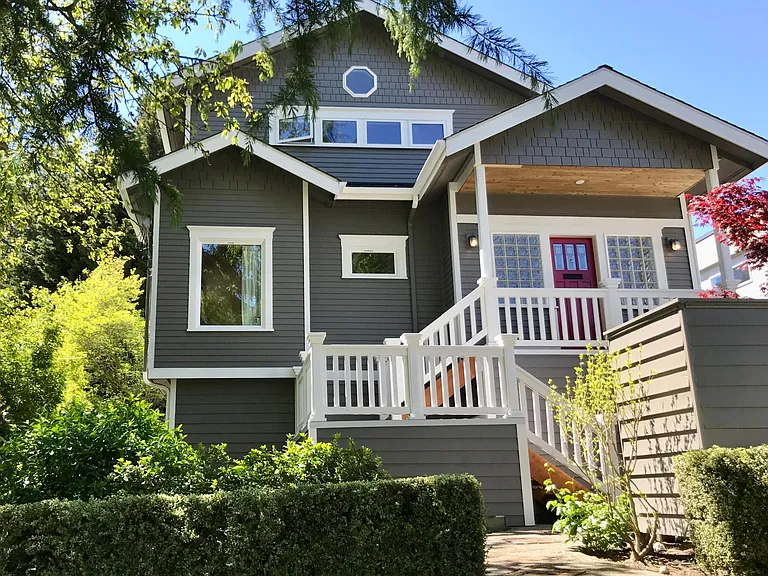 On a quiet Ballard street, the home entrance has a newer front porch