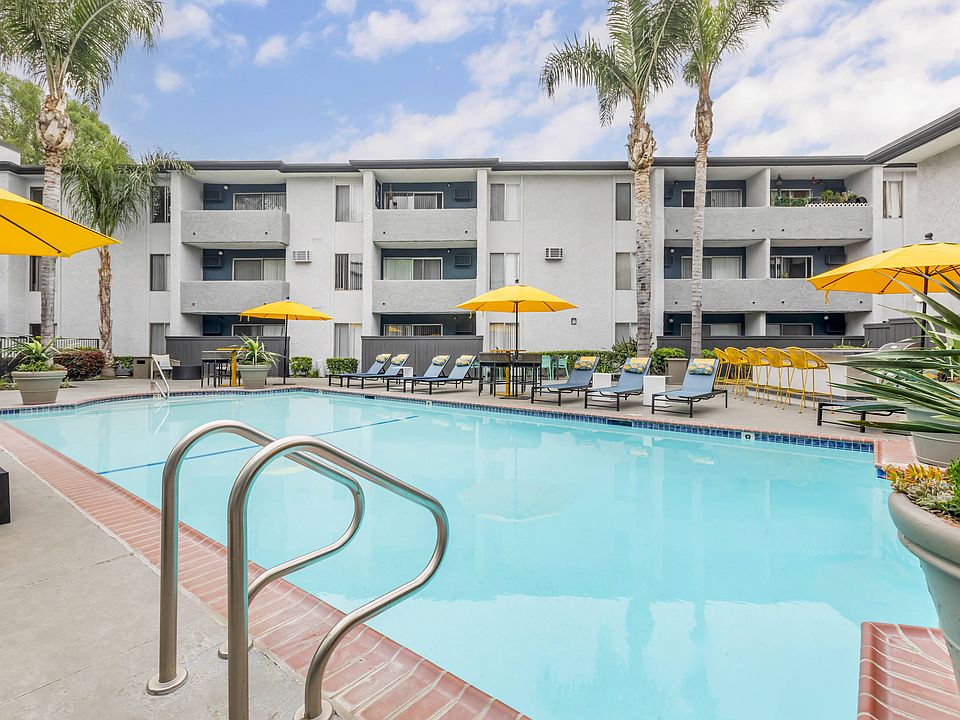 Experience luxury living, where our pool area is a vibrant retreat. From the cheerful yellow umbrellas to the updated tables and chairs, every detail is designed for your relaxation and enjoyment.