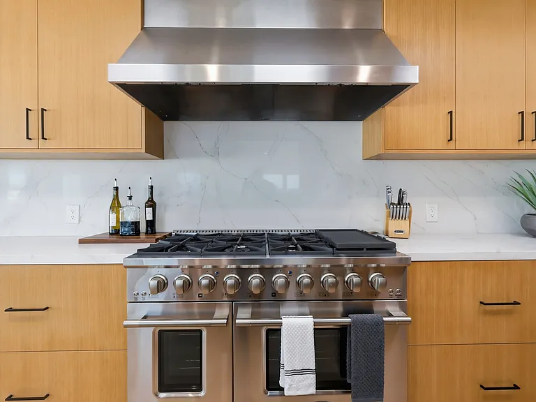 At the top of the third floor you will find a chef's kitchen with walk-in pantry, breakfast nook, 8-sit dining table, and rooftop patio with direct stair access to the street