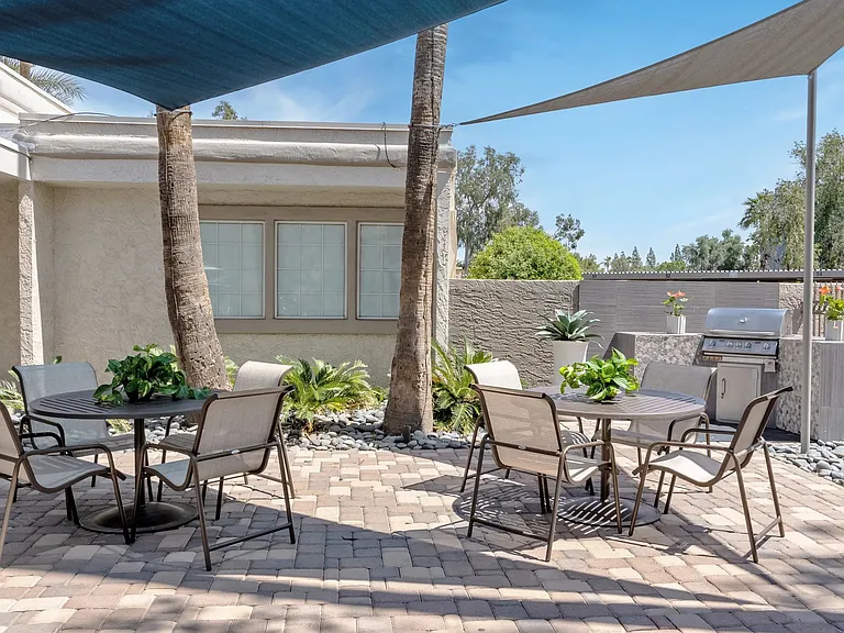 Enjoy beautiful Arizona weather year-round in our shaded outdoor gathering space. It's the perfect setting for grilling, relaxing, and spending time with family and friends!