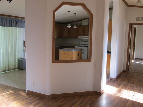 Between living room and kitchen