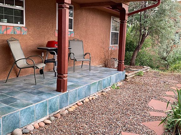 Front enclosed porch with side yard at end