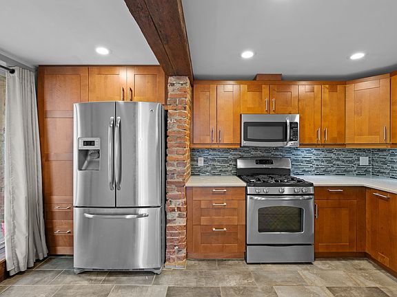 Kitchen with sliders to side yard